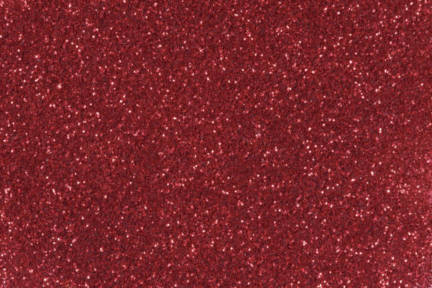 istock Red glitter texture Christmas background. Low contrast photo. 1082405322