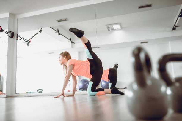 istock Warming Up In Front Of Mirror Gym 1082406202