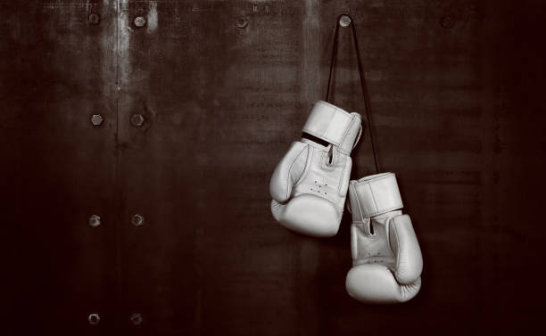 istock Boxing Gloves Hanging On Wall 1082406554
