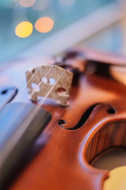 istock violin with blurred perspective bokeh light blue bokeh background 1082406832