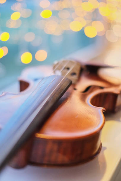istock violin with blurred perspective bokeh light blue bokeh background 1082406834