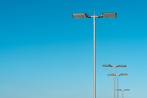 LED Street Lamps Affixed to an Iron Post Against