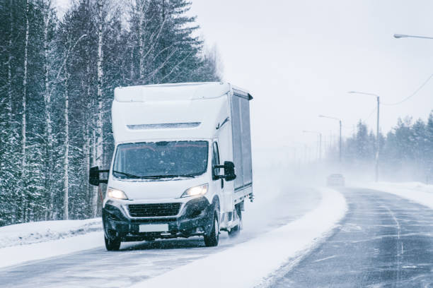 mini van nella snowy winter road in finlandia lapponia - covered truck foto e immagini stock