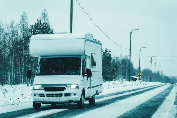 istock Rovaniemi Caravan RV in road at winter 1082412586