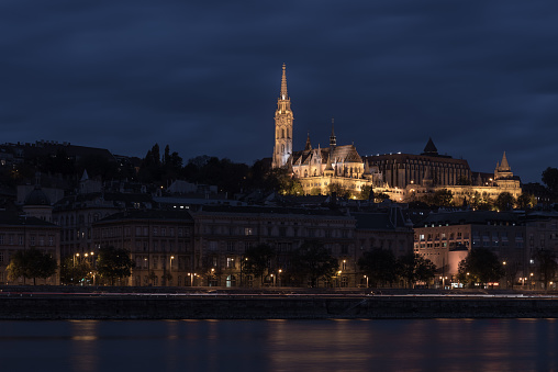 Fisherman's Bastion, Budapest, Hungary, illuminated at night, viewed from across the river Danube