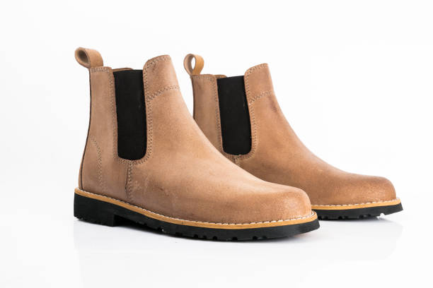 istock Male brown leather boots on white background. 1082424134