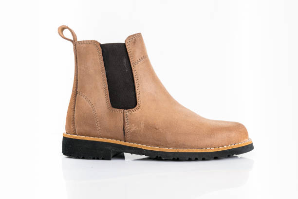 istock Male brown leather boots on white background. 1082424148