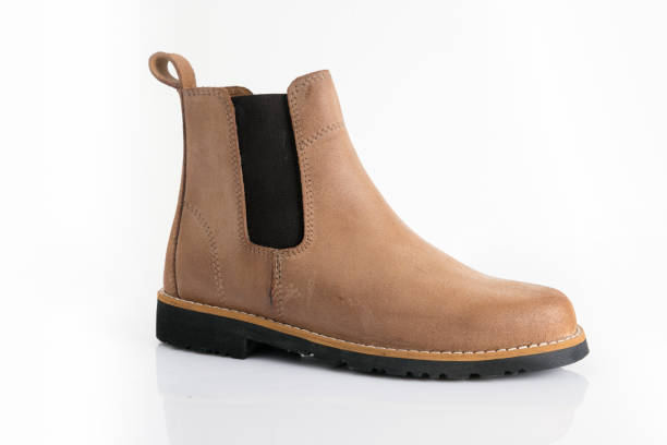 istock Male brown leather boots on white background. 1082424158