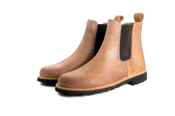 istock Male brown leather boots on white background. 1082424404