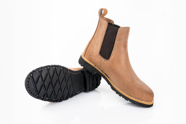 istock Male brown leather boots on white background. 1082424416