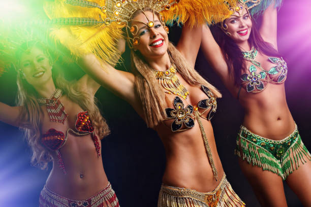 istock Brazilian women dancing samba over black background 1082426198