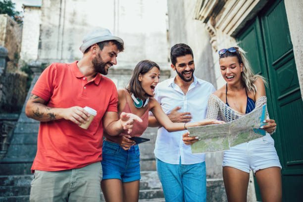istock Young happy tourists sightseeing in city 1082427444