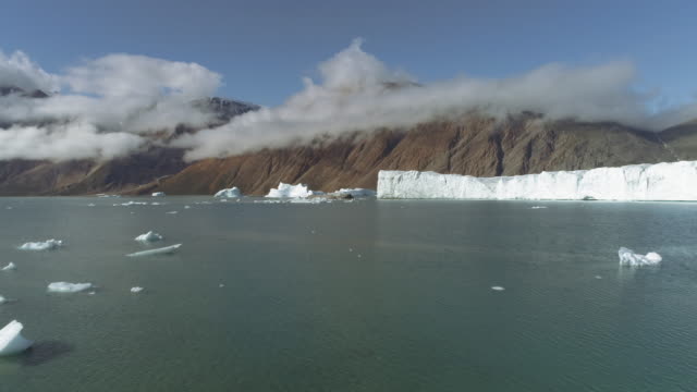 Drone Footage Flying Towards The Face Of A Retreating Glacier With Icebergs, Greenland, Climate Change, Glacier