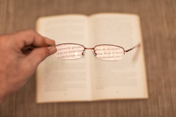 Books and glasses on  table  background,close up