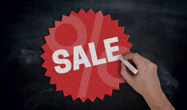 Hand paints with chalk Sale on blackboard Concept Hand paints with chalk Sale on blackboard Concept. 18797 stock pictures, royalty-free photos & images