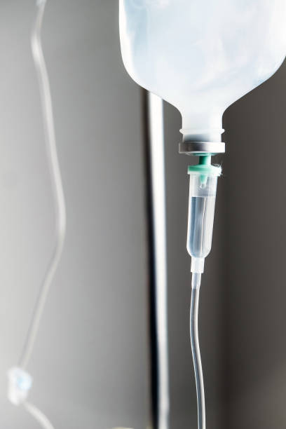 istock IV saline solution drip for patient in hospital 1082433950