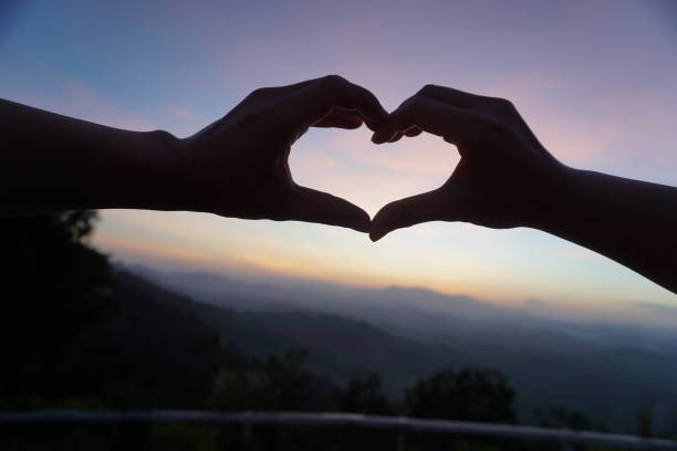 istock silhouette heart shape in morning 1082438676