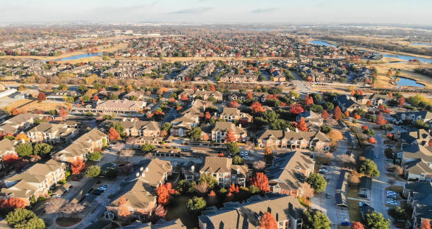istock Panoramic aerial view apartment complex and sprawl subdivision with fall foliage near Dallas 1082441502