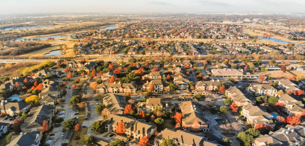 istock Panoramic aerial view apartment complex and sprawl subdivision with fall foliage near Dallas 1082443756