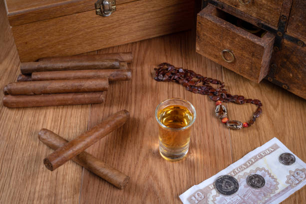 Close up of cigars on bar table with blurred background.
