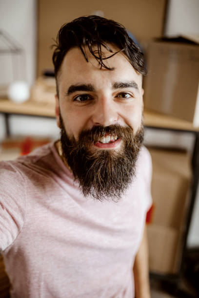 Smile for customers Bearded men working from home on drop shipping selfie photos stock pictures, royalty-free photos & images