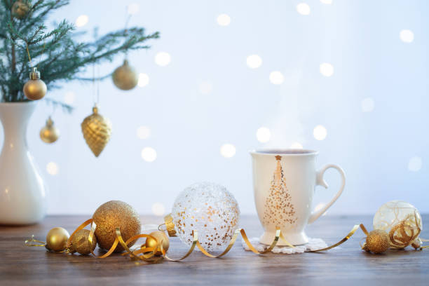istock white cup and  christmas decorations on white background 1082454130