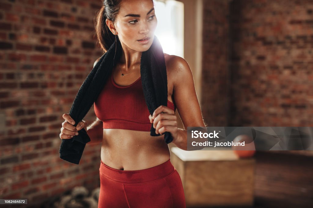 Female Relaxing After Workout At Gym Stock Photo - Download Image Now -  Women, One Woman Only, Gym - iStock