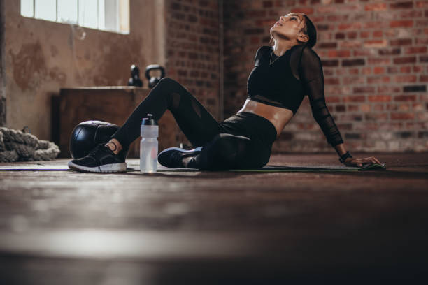 istock Tired woman taking rest after intense training 1082454948