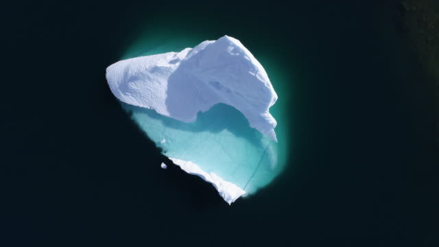 Overhead Aerial Drone Footage of a Large Iceberg in Greenland - Lifting up