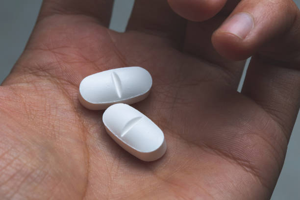 istock Cropped Image Of Hand Holding Capsules 1082462314