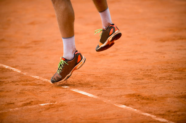 istock Low Section Of Man Playing On Ground In Court 1082464550