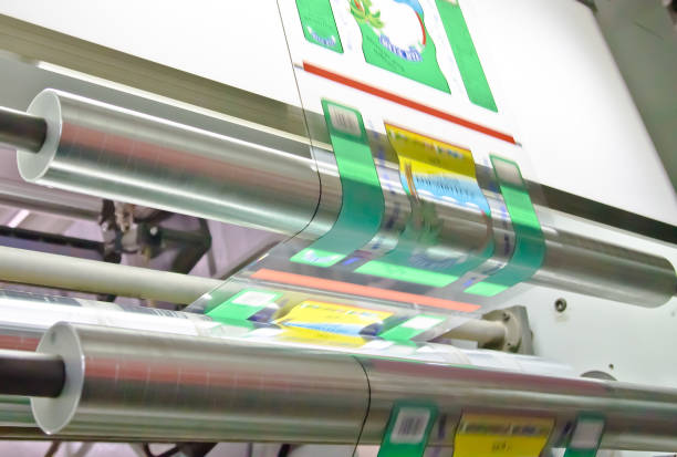 istock doypack making packaging machine in modern factory with white rolls  and plastic film running 1082467788