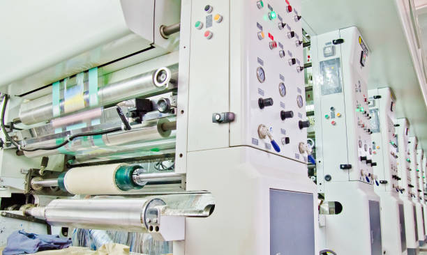 istock doypack making packaging machine in modern factory with white rolls  and plastic film running 1082467796