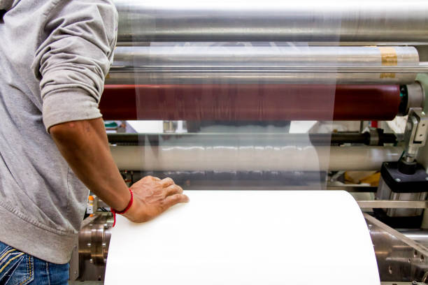 istock doypack making packaging machine in modern factory with white rolls  and plastic film running 1082467836