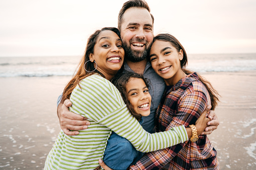 Smiling parents with two children