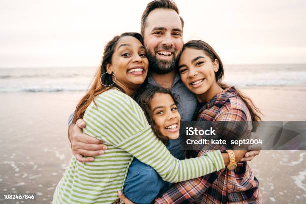 Smiling Parents With Two Children Stock Photo - Download Image Now - Family, Multiracial Group, Teenager