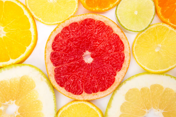 istock cut pieces of different citrus fruits on white background 1082474776