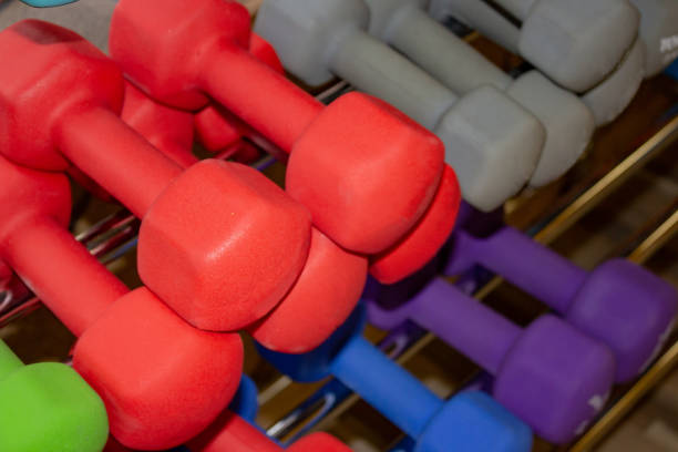 istock Dumbbells of different colors and sizes 1082475014