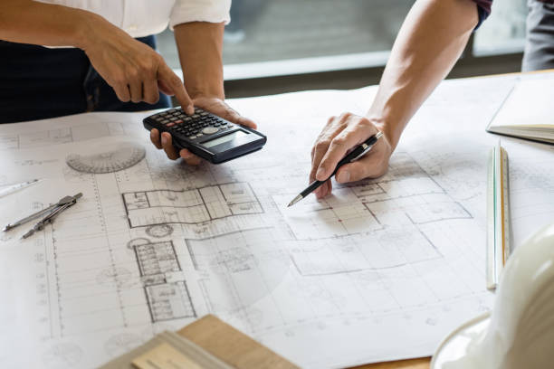 istock Image of engineer or architect partner meeting for working with architectural project, drawing and sketching for inspection architectural project on blueprint at workspace 1082477204