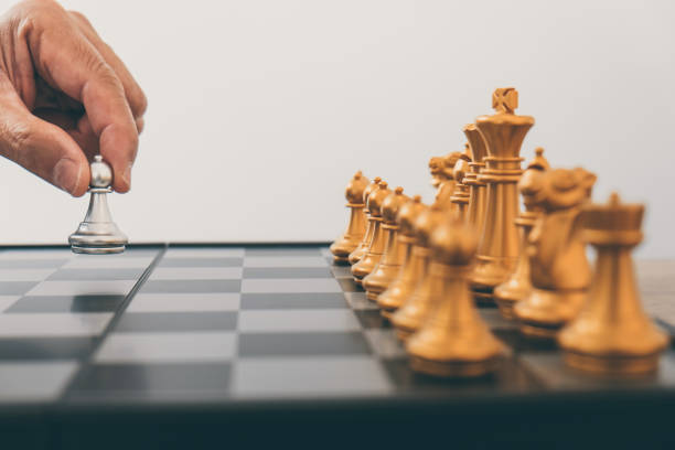 istock Businessman leadership playing chess and thinking strategy plan about crash overthrow the opposite team and development analyze for successful of corporate 1082477320