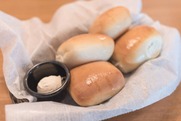istock Texas Roadhouse Rolls with Cinnamon Honey Butter in a basket.; 1082480332