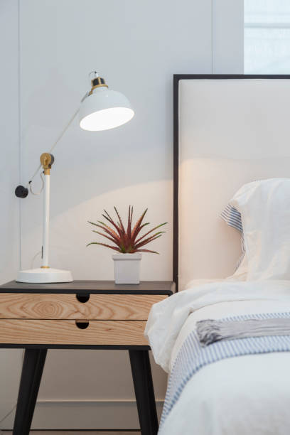 istock Modern home interior with bedroom setting including bedside table ,white lamp. 1082484284