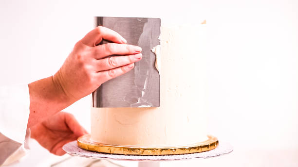 istock Baker frosting pink and purple cake 1082486350