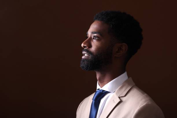 istock Beautiful black man in front of a colored background 1082486814