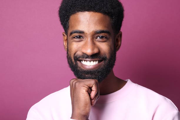 istock Beautiful black man in front of a colored background 1082487752