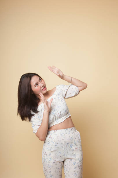 istock Excited young Asian woman look up. 1082488792