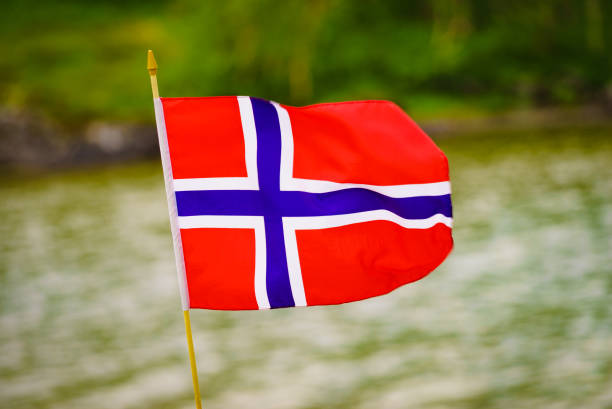 istock The norwegian flag against green nature 1082495646
