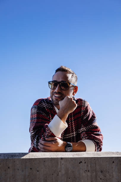 istock Boy posing on the street with sunglasses 1082496450