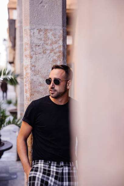 istock Boy posing on the street with sunglasses 1082496486