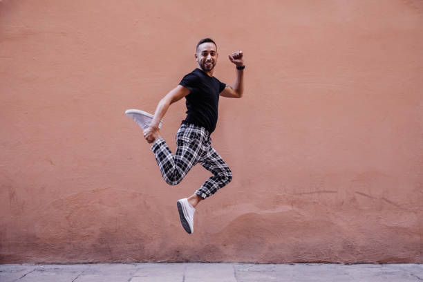 istock Young boy jumping on the street 1082496512